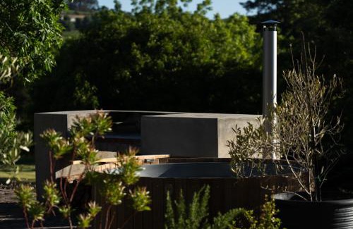 Stellenbosch Apartment | Avemore Vineyard View - wood fired hot tub and full power back up