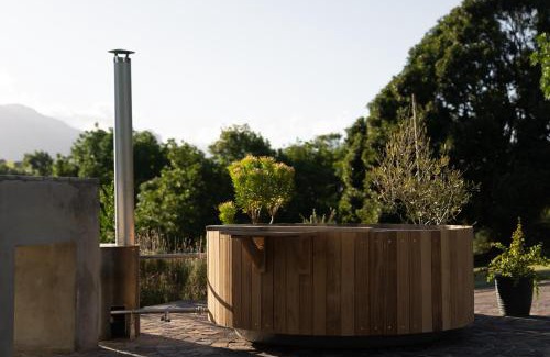 Stellenbosch Apartment | Avemore Vineyard View - wood fired hot tub and full power back up