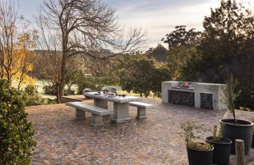 Stellenbosch Apartment | Avemore Vineyard View - wood fired hot tub and full power back up