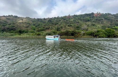 Mzamba Beach Boat Rental | Baby Blue Houseboat