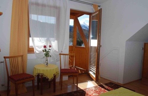 Doebriach Bed & Breakfast | Balcony room with lake view on the 2nd floor - Frühstückspension Käfer