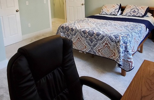 Williston North Condo | Basement Space with bedroom, living room, movie theatre and gym.