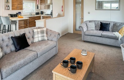 Llansantffraed Ski Chalet | Bay view lodge offers just that, breathtaking views of Ceredigion Bay.