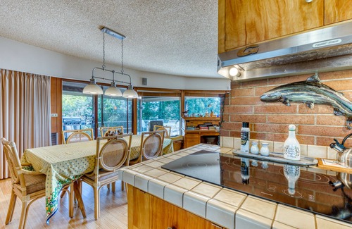 North Bend House | Bayfront home with fitness room, WiFi & fun-filled game room