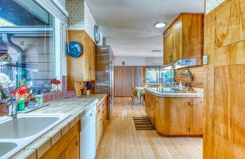 North Bend House | Bayfront home with fitness room, WiFi & fun-filled game room