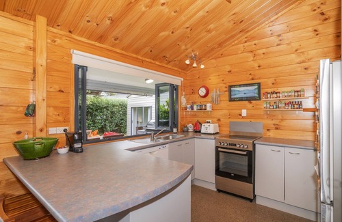 Pauanui House | Beach house vibes plus sleep out for 2nd family or teenagers. Pet friendly.