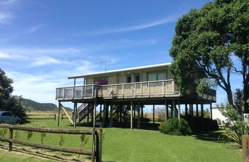 Whangaruru House | Beachfront Bland Bay tranquility with stunning sea views from sun-drenched deck