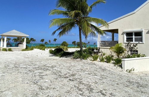 Whitby House | Beachfront, wifi-enabled, whole-house A/C, room for 7, & watersports equipment
