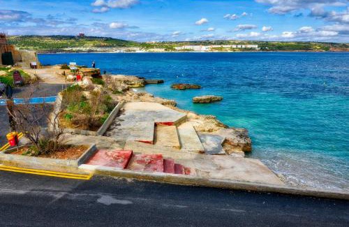 Għadira Apartment | BEACHFRONT with Seaviews Apartment No56 Award Winner Unbeatable Location for Closeness to the Sea Ideal for Guests looking for Winter Spring and Autumn Breaks in Sunny Malta Also Ideal for Coastal Hikers