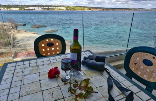 Għadira Apartment | BEACHFRONT with Seaviews Apartment No56 Award Winner Unbeatable Location for Closeness to the Sea Ideal for Guests looking for Winter Spring and Autumn Breaks in Sunny Malta Also Ideal for Coastal Hikers