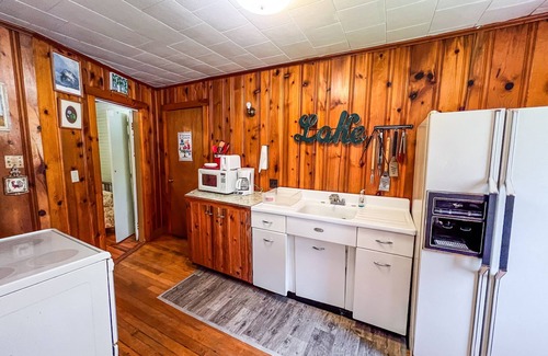 Wells Cottage | Beautiful and serene cottage with beach, dock, lake views, fishing, and A/C