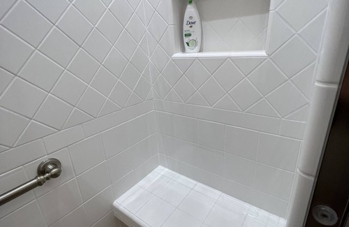 Healy Bed & Breakfast | Beautiful bedroom with king bed and large tiled shower, Room 5