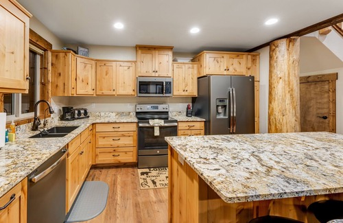 Bigfork House | Beautiful cabin overlooking Swan Lake with 2-level deck, fireplace & firepit