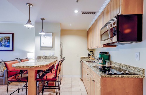 Isle of Palms Condo | Beautiful condo with private balcony, W/D, firepit, full kitchen, and gym