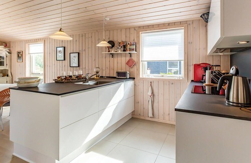 Nykøbing House | Beautiful cottage with kitchen open connection with dining and living room with an alcove.