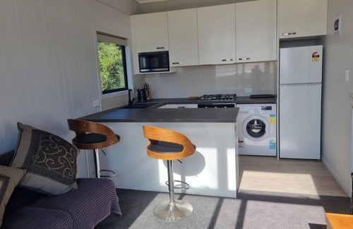 Clarks Beach Apartment | Beautiful harbour and rural farm views. Stunning views of sky tower and airport.