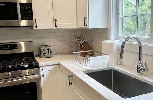 Springs House | Beautiful Home with walking distance to the beach, new 46ft pool! EV charger