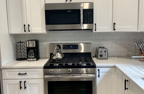 Springs House | Beautiful Home with walking distance to the beach, new 46ft pool! EV charger