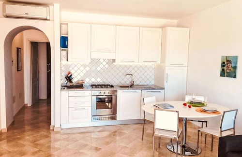 Porto Pozzo Apartment | Beautiful apartment for 4 guests with pool, WIFI, A/C, TV, terrace, pets allowed and parking
