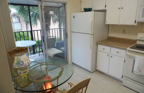 East Naples Condo | Beautiful lake view huge pool 4 miles to Gulf beaches