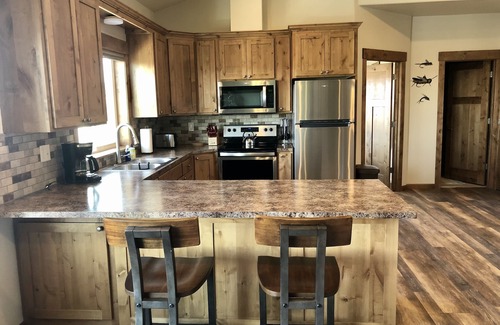 Ashton Apartment | Beautiful loft apartment overlooking the Henry’s Fork River at the Ora Bridge!