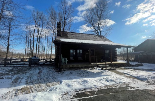 Lawrence Cabin | Beautiful log cabin with all the creature comforts of home. Private fishing lake