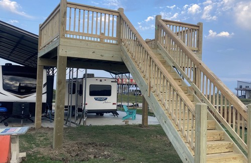 Port Bolivar House | Beautiful NEW 2023 camper covered on concrete slab. Sit and enjoy the barges