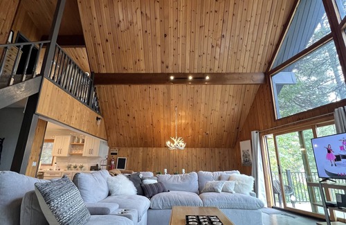 Blue Jay Cabin | Beautiful updated 3 level home with high ceilings, a wall of windows & game room
