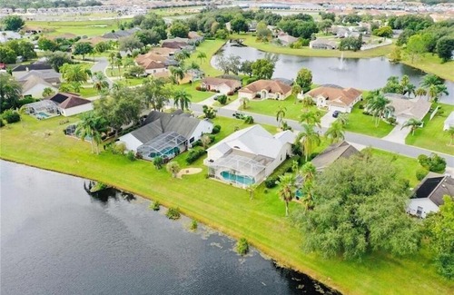 Sunridge Woods House | Beautiful Waterfront Home with Heated Pool and Game Room