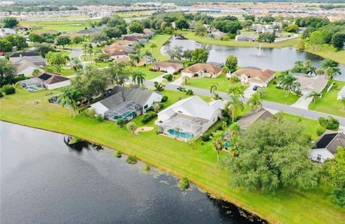 Sunridge Woods House | Beautiful waterfront home with heated pool and game room.
