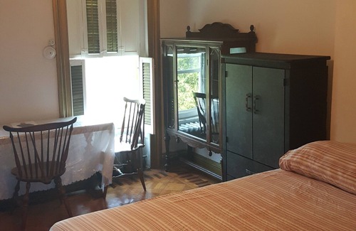 Clinton Hill Bed & Breakfast | BEDROOM # 1 WITH AN EVENT SPACE AND BACK PORCH