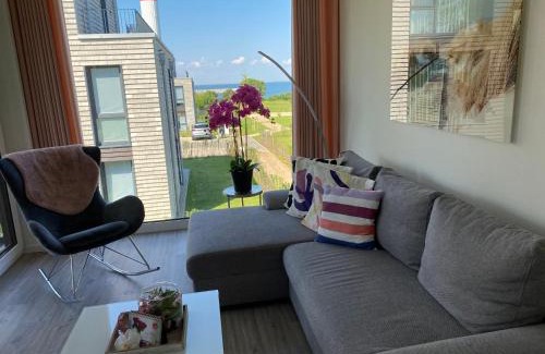 Marienleuchte Apartment | BeltBlick Fehmarn - moderne Ferienwohnung mit Meerblick und Sauna - Neubau