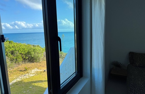 Gregory Town House | Big Pink:nmid-century modern 2bedroom oceanfront home on cliffs of Gregory Town