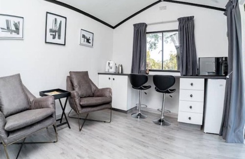 Hartbeespoort Ski Chalet | Black and White House