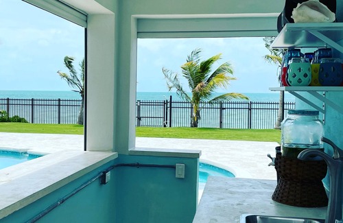 Coral Harbour House | Blue Birds Beach House, right on the beach with a large backyard & heated pool.