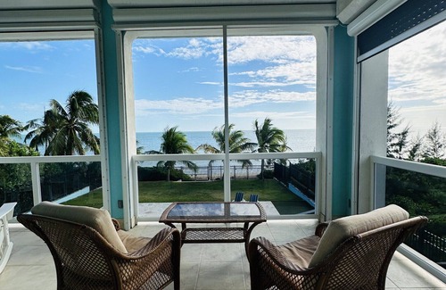 Coral Harbour House | Blue Birds Beach House, right on the beach with a large backyard & heated pool.