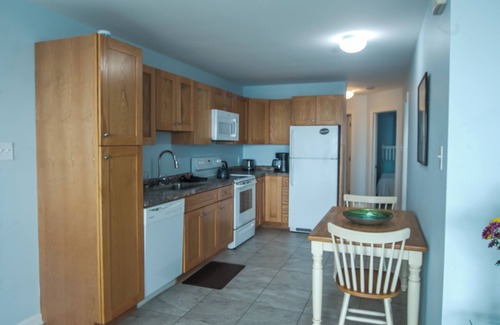 North End Apartment | Boardwalk gem. Enjoy your private deck and watch the ocean.