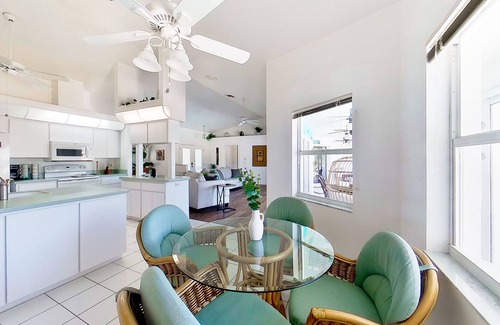 Pebble Beach House | Bohemian canal-front retreat with pool, beach gear, adult bikes, & AC - dogs ok