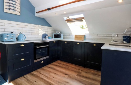 Rhoscolyn House | BORTH ARIAN BOAT HOUSE, pet friendly, with open fire in Rhoscolyn