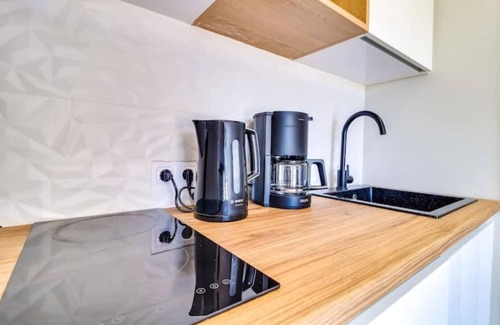 Thymari Villa | Boutique 2BR apartment in villa. Shared pool. Partial seaview