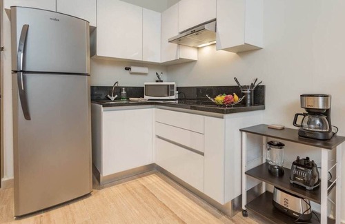 Centro Apartment | Brand New 1BR w/amazing Rooftop steps from 5th Ave