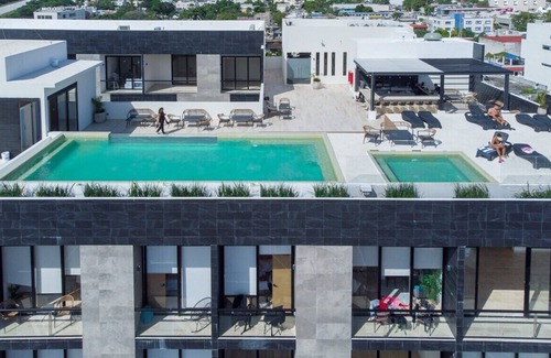 Centro Apartment | Brand New 1BR w/amazing Rooftop steps from 5th Ave