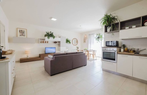 Ta' Pennellu Apartment | Bright and stylish 2-bedroom apartment in the heart of Mellieha, Malta. Located in a quiet residential area, it features a charming louvered balcony, large sunlit windows, and modern interiors with natural touches