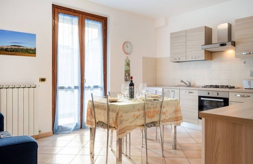 Bastia Umbra Apartment | Bright and very spacious apartment, which in 165 sqm accommodates 8 people with great comfort, having three bedrooms and two bathrooms. The flat is located in a villa and has access to the garden with an equipped patio and gazebo, shared with the other a