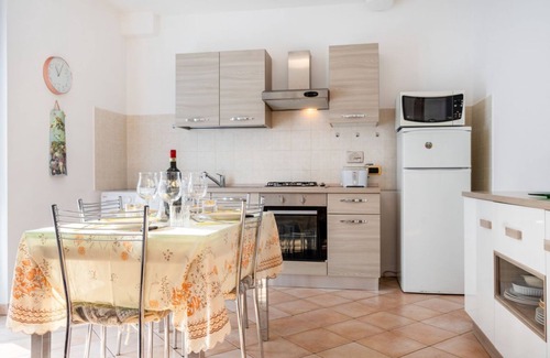 Bastia Umbra Apartment | Bright and very spacious apartment, which in 165 sqm accommodates 8 people with great comfort, having three bedrooms and two bathrooms. The flat is located in a villa and has access to the garden with an equipped patio and gazebo, shared with the other a
