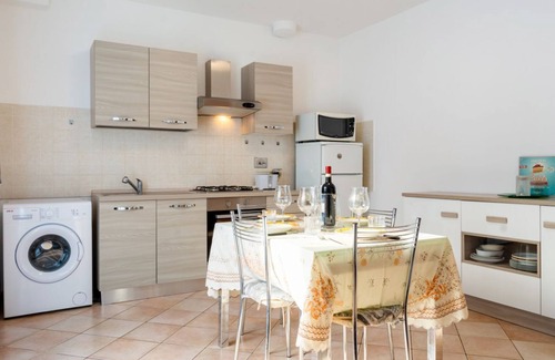 Bastia Umbra Apartment | Bright and very spacious apartment, which in 165 sqm accommodates 8 people with great comfort, having three bedrooms and two bathrooms. The flat is located in a villa and has access to the garden with an equipped patio and gazebo, shared with the other a