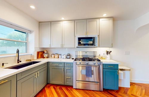 Encanto House | Bright dog-friendly home with large yard, outdoor projector, smart TVs, & W/D
