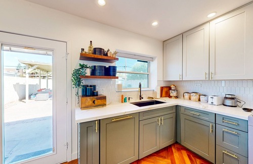 Encanto House | Bright dog-friendly home with large yard, outdoor projector, smart TVs, & W/D