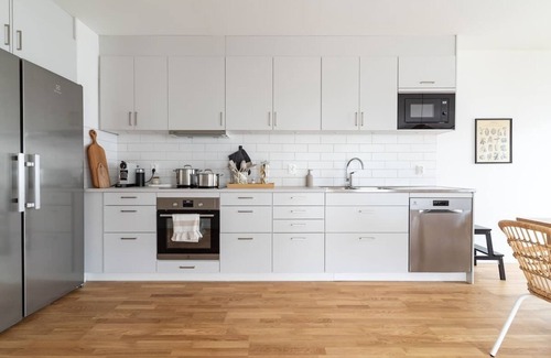 Bastad Condo | Bright Ground Floor Corner Home with Cozy Outdoor