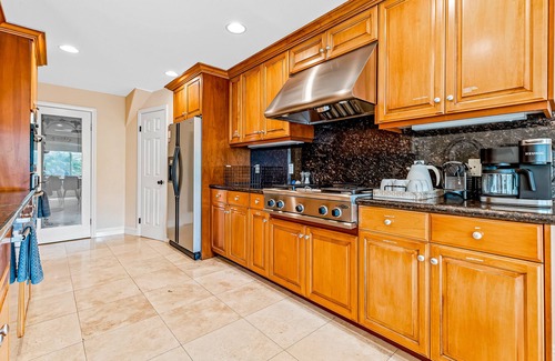 Naples House | Bright home on the channel with expansive patio & elevator